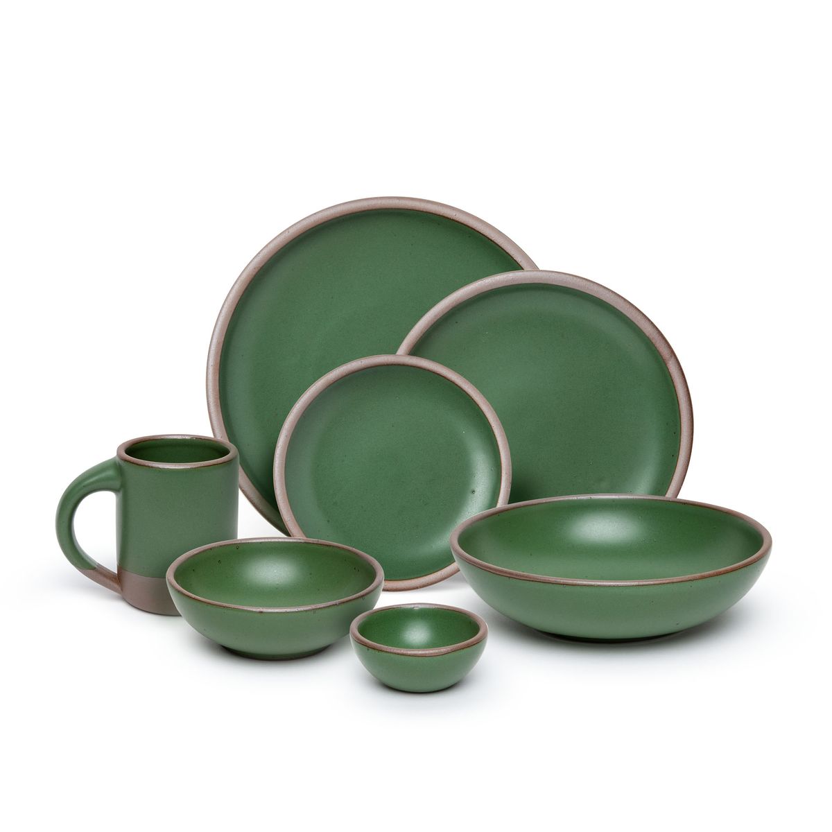 The Mug, bitty bowl, breakfast bowl, everyday bowl, cake plate, side plate and dinner plate paired together in a deep, verdant green color featuring iron speckles
