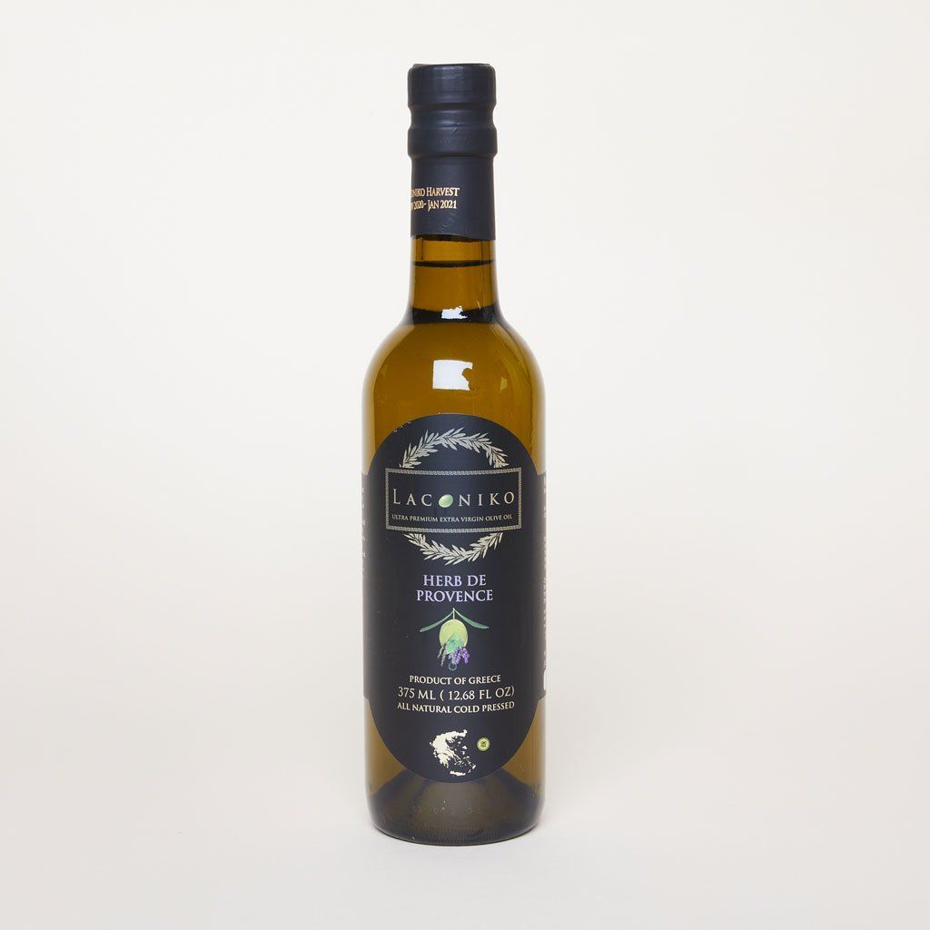 A tall bottle of olive oil with a black label