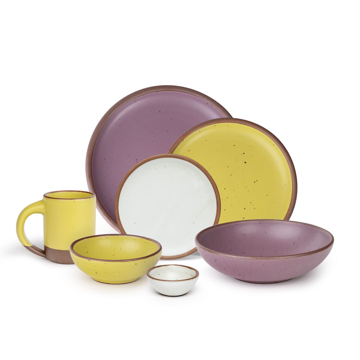 The Mug, side plate, and breakfast bowl in zesty yellow, the bitty bowl and cake plate in eggshell, the everyday bowl and dinner plate in a soft mauve purple color.
