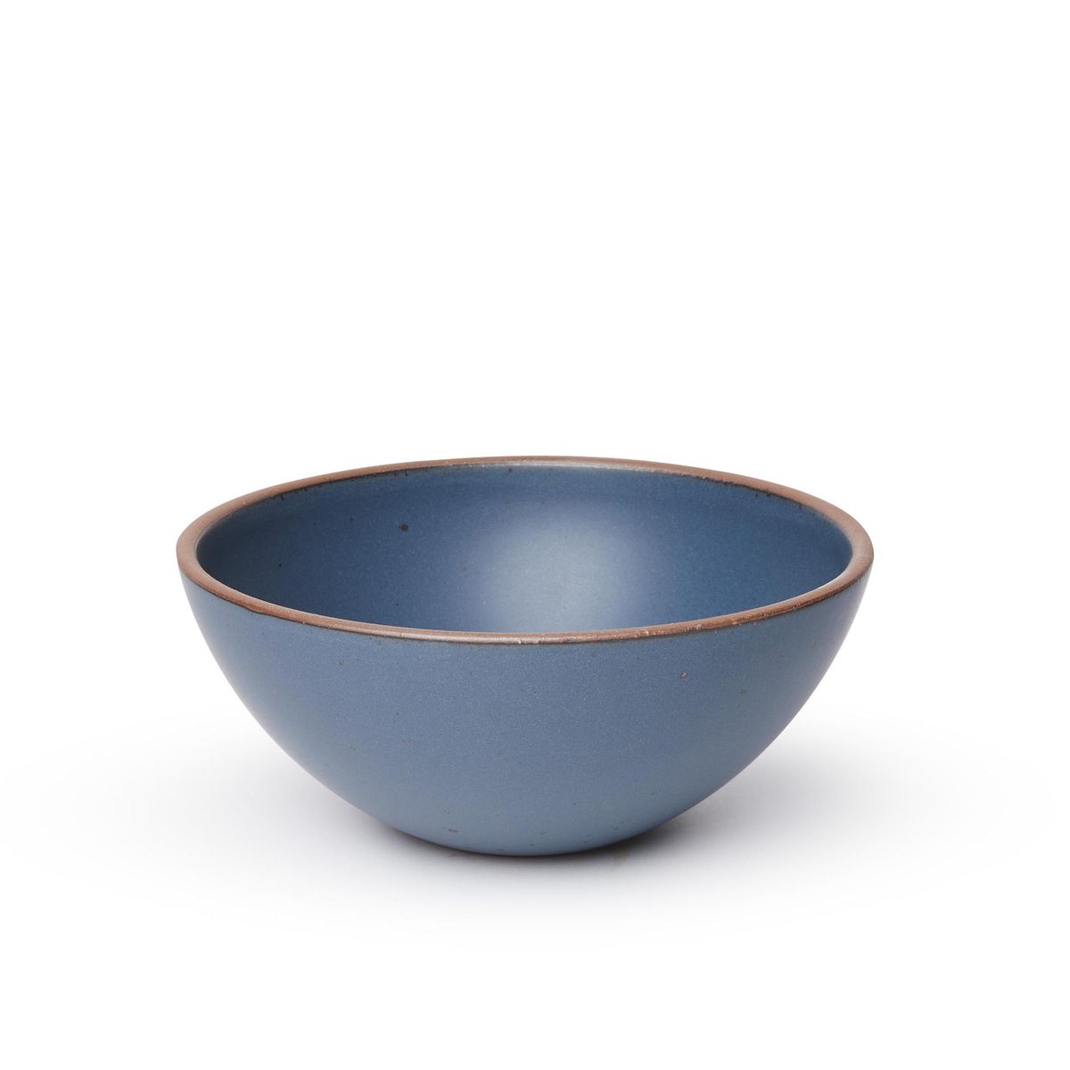 A large rounded ceramic bowl in a toned-down navy color featuring iron speckles and an unglazed rim
