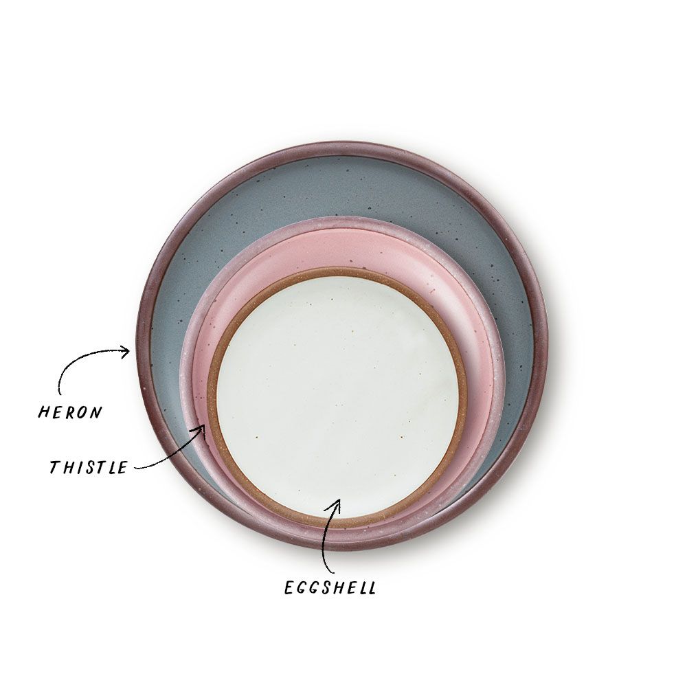 A stack of 3 plates in Dinner, Side, and Cake sizes in a dusty mauve pink, blue-grey, and cool white colors.