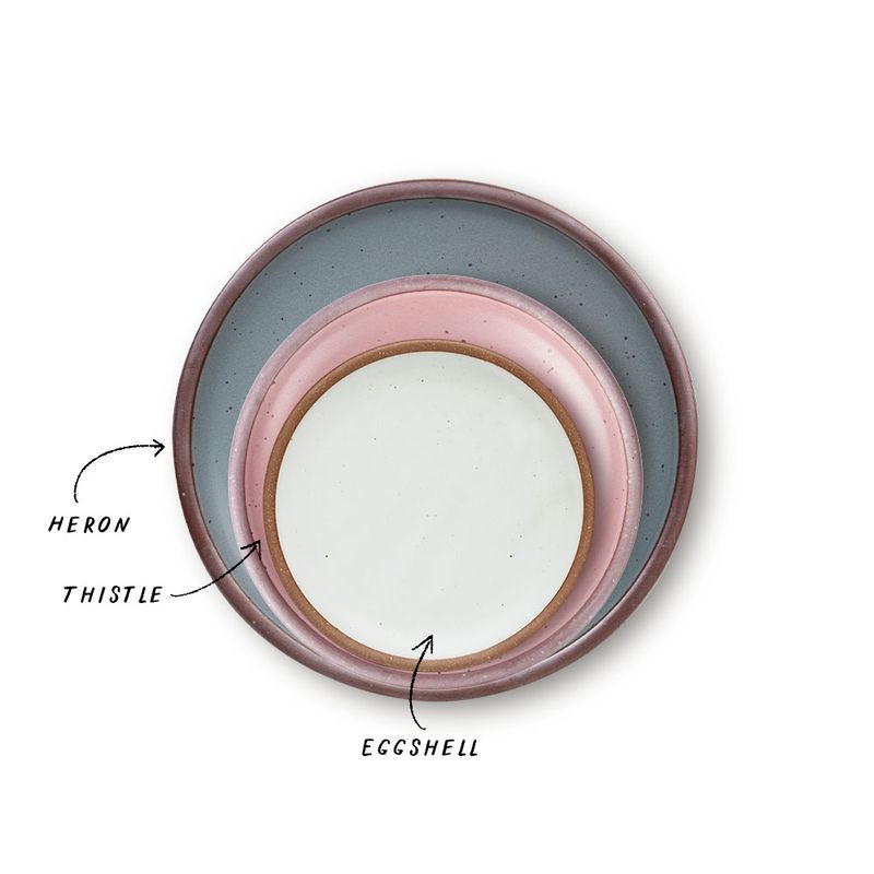 A stack of 3 plates in Dinner, Side, and Cake sizes in a dusty mauve pink, blue-grey, and cool white colors.