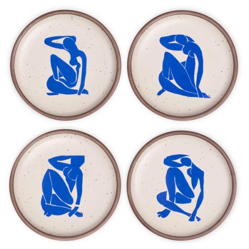 Four ceramic dinner plates in warm off-white colors and unglazed rim, each with a different blue decal from the Nu Bleu series by Henri Matisse.