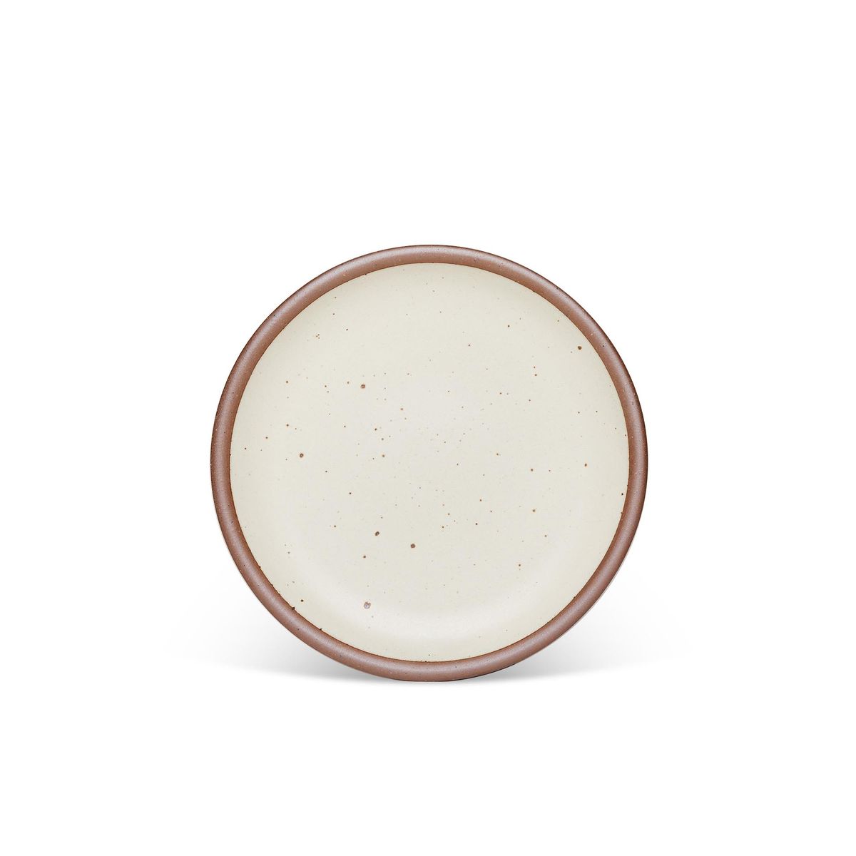 A medium sized ceramic plate in a warm, tan-toned, off-whitecolor featuring iron speckles and an unglazed rim.