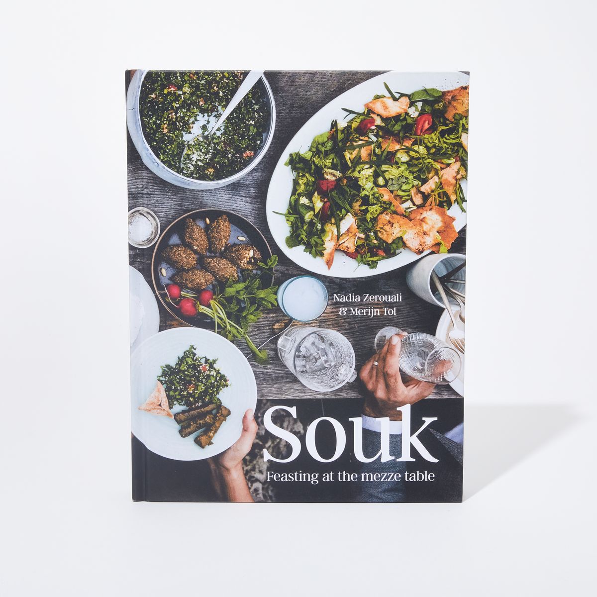Book cover with a overhead photo of a table with a variety of mezze with the title "Souk" and the text "Feasting at the mezze table"