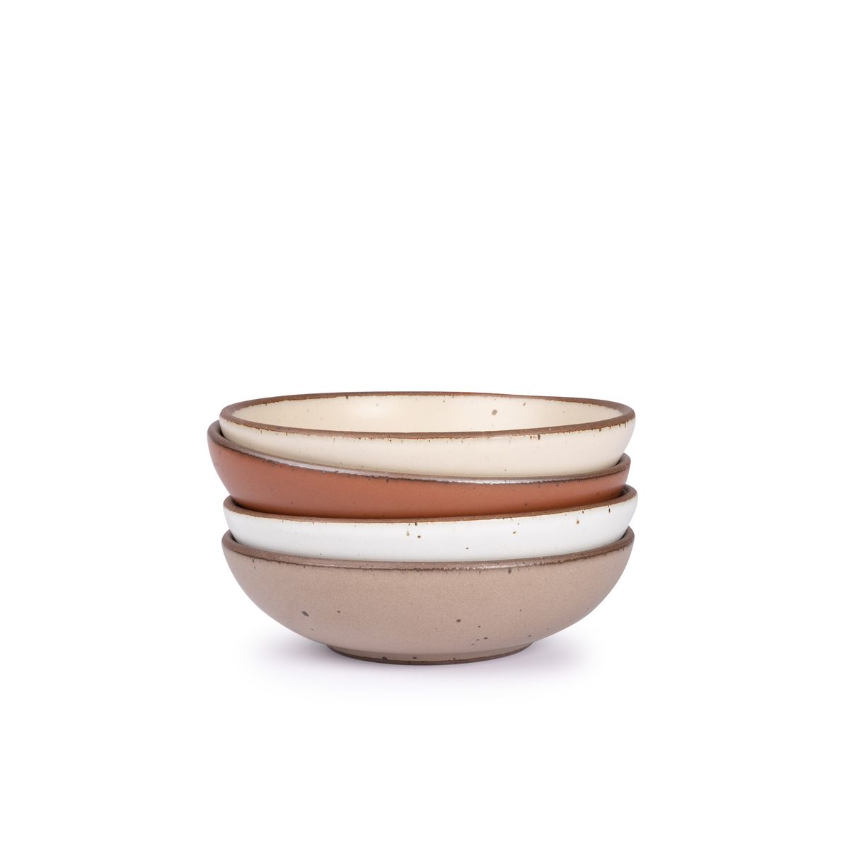 A stack of 4 dinner-sized shallow ceramic bowls in a warm off-white, cool terracotta, cool white, and pale warm brown colors featuring iron speckles and an unglazed rim