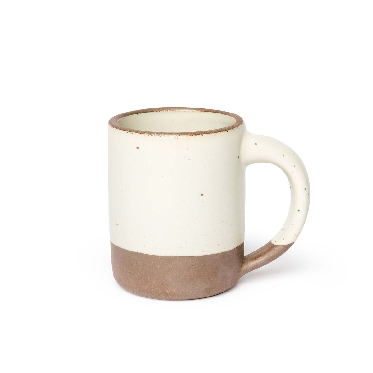 A big sized ceramic mug with handle in a warm, tan-toned, off-white glaze featuring iron speckles and unglazed rim and bottom base.