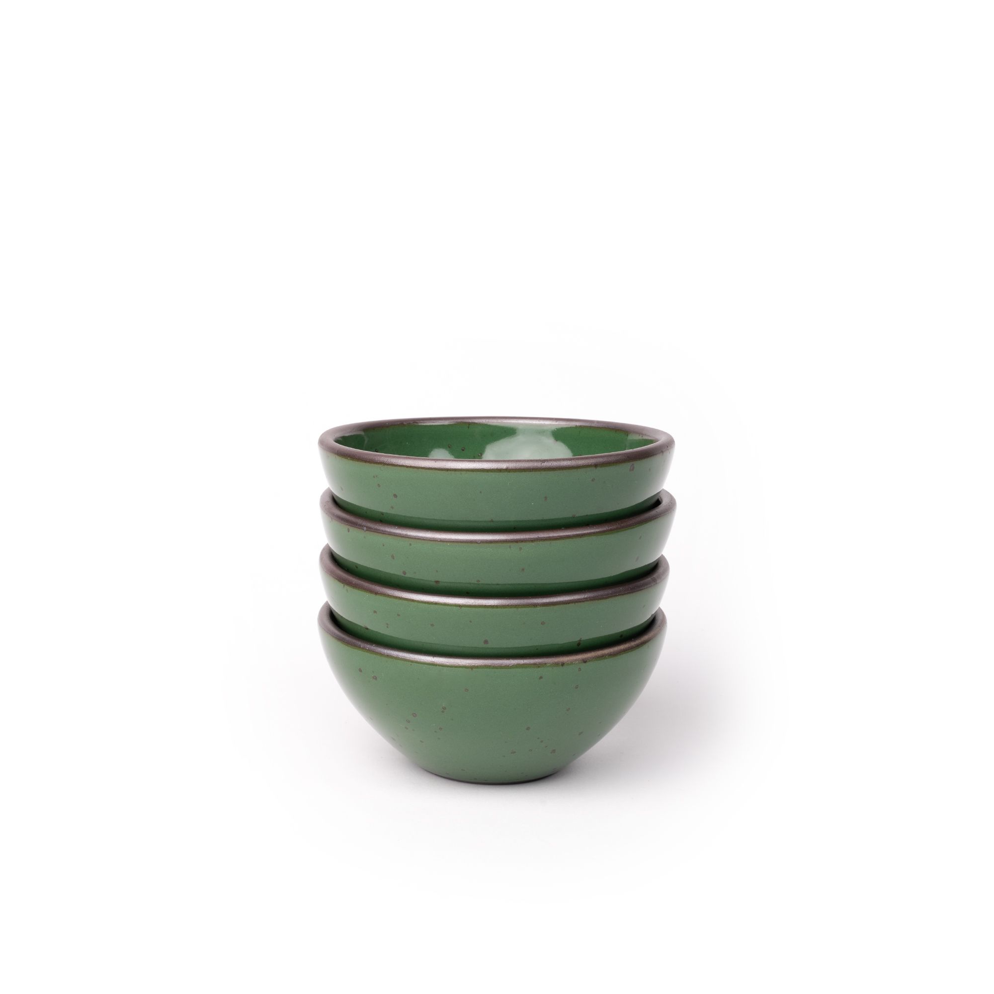A stack of 4 small dessert sized rounded ceramic bowls in a glossy emerald green color featuring iron speckles and an unglazed rim