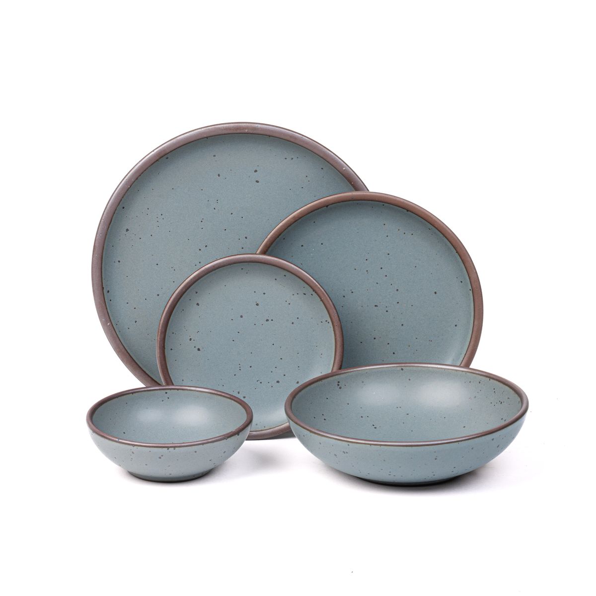 A breakfast bowl, everyday bowl, cake plate, side plate and dinner plate paired together in a blue-grey color featuring iron speckles