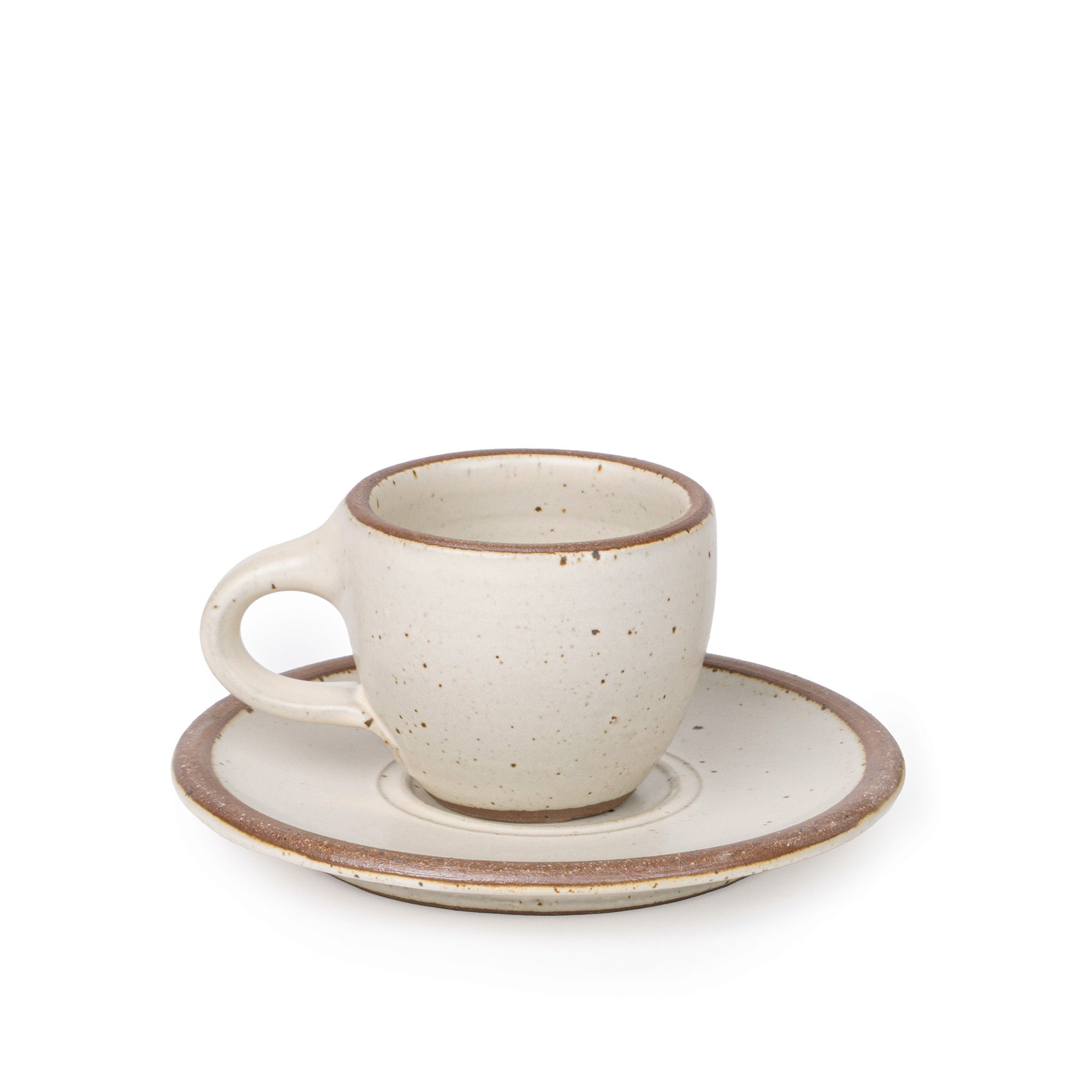 Small stoneware espresso cup with handle and saucer, in a warm off-white color with iron speckles.