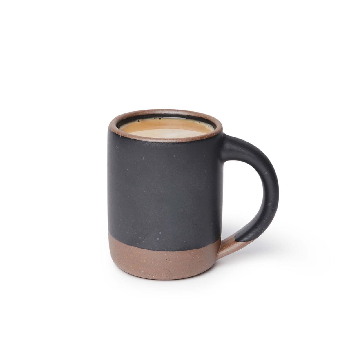 A medium sized ceramic mug filled with coffee with handle in a graphite black color featuring iron speckles and unglazed rim and bottom base.