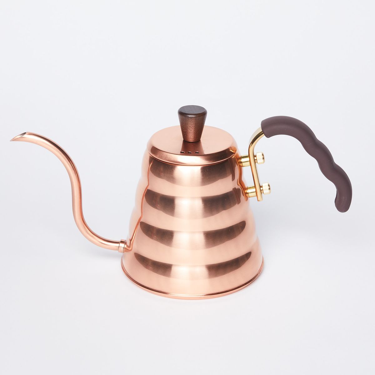 Copper kettle with tapered round base and curvy slim spout with black rubber covered handle