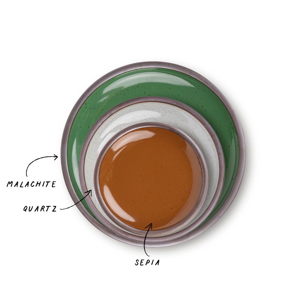 A stack of 3 plates in Dinner, Side, and Cake sizes in a glossy emerald green, glossy brown, and reflective icy white colors.