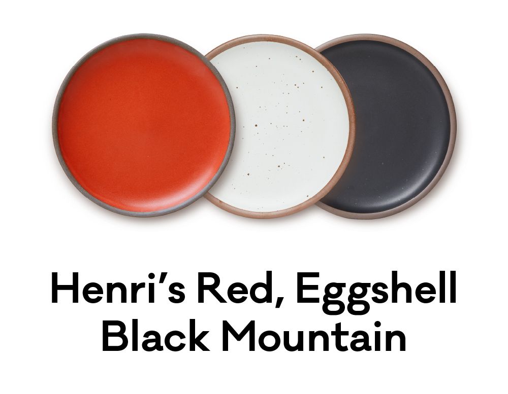 A bold palette of red, white and black plates are positioned next to each other. Underneath, text reads "Henri's Red, Eggshell, Black Mountain."