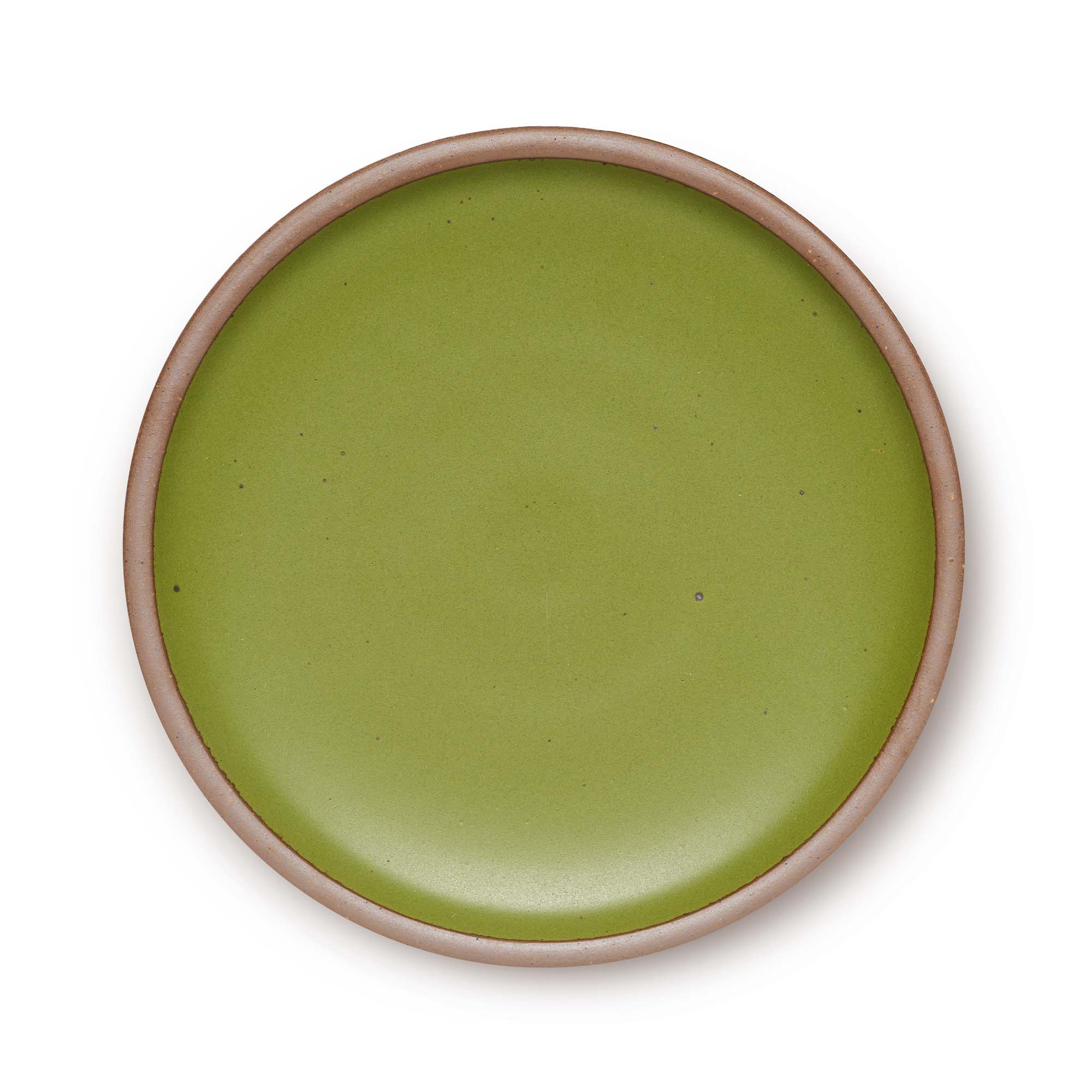 A large ceramic platter in a warm fern green color featuring iron speckles and an unglazed rim.