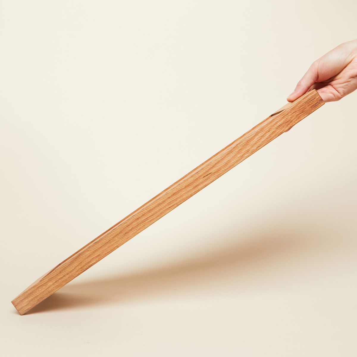Edge of charcuterie board, emphasizing wood grain