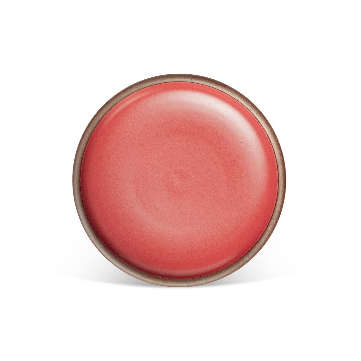A dinner sized ceramic plate in a bold red color featuring iron speckles and an unglazed rim