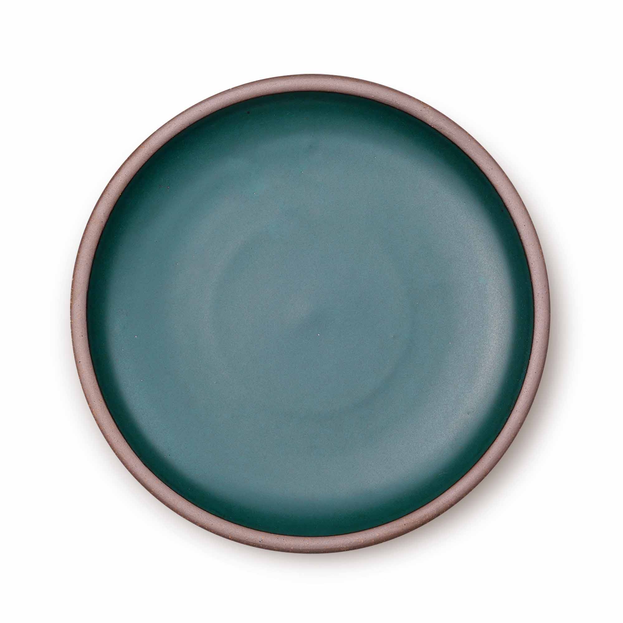 A large ceramic platter in a dark cool teal color featuring an unglazed rim.