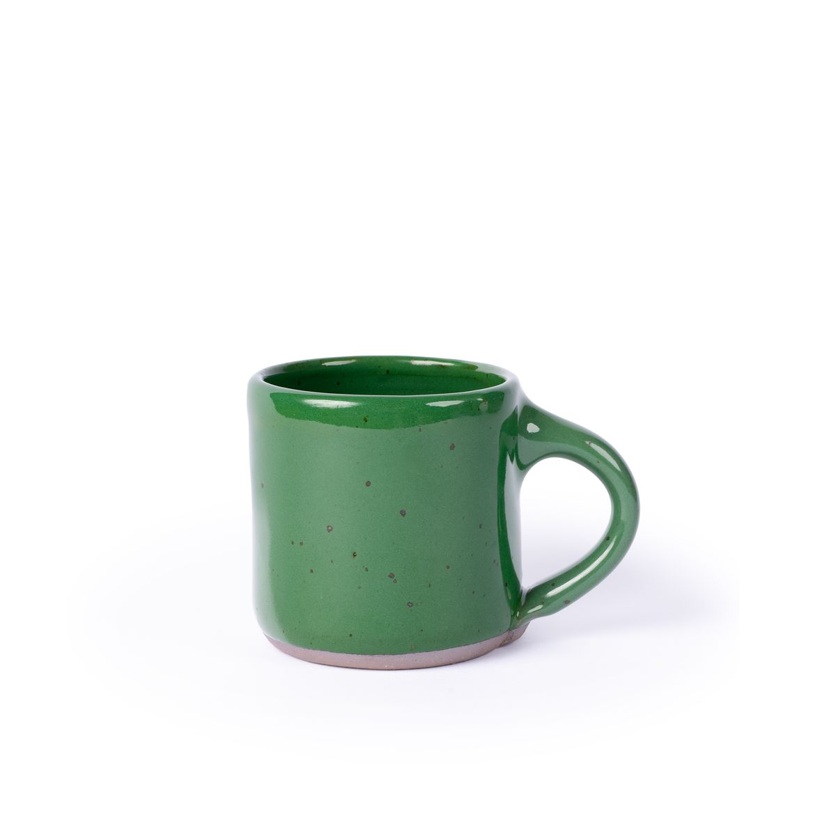 A medium sized ceramic mug with handle in a glossy emerald green color featuring iron speckles