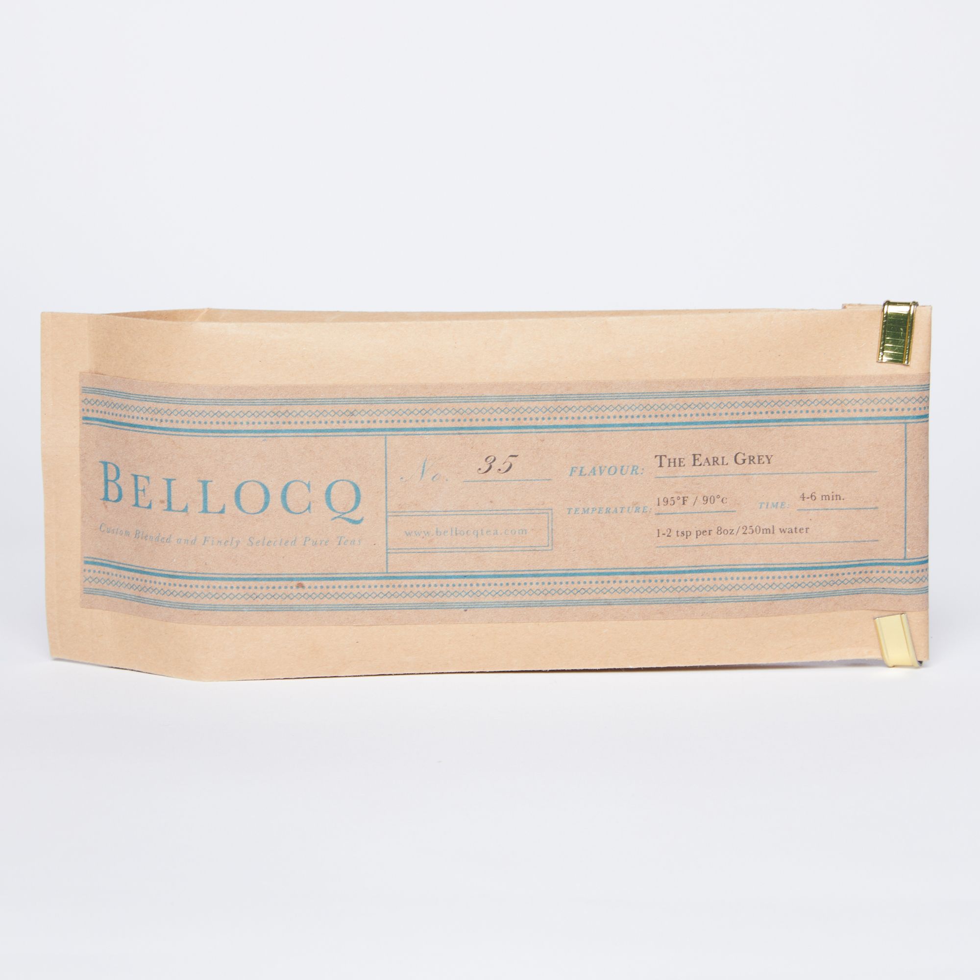 Brown paper bag with blue stripes on each side and a 'Bellocq' logo and label. 