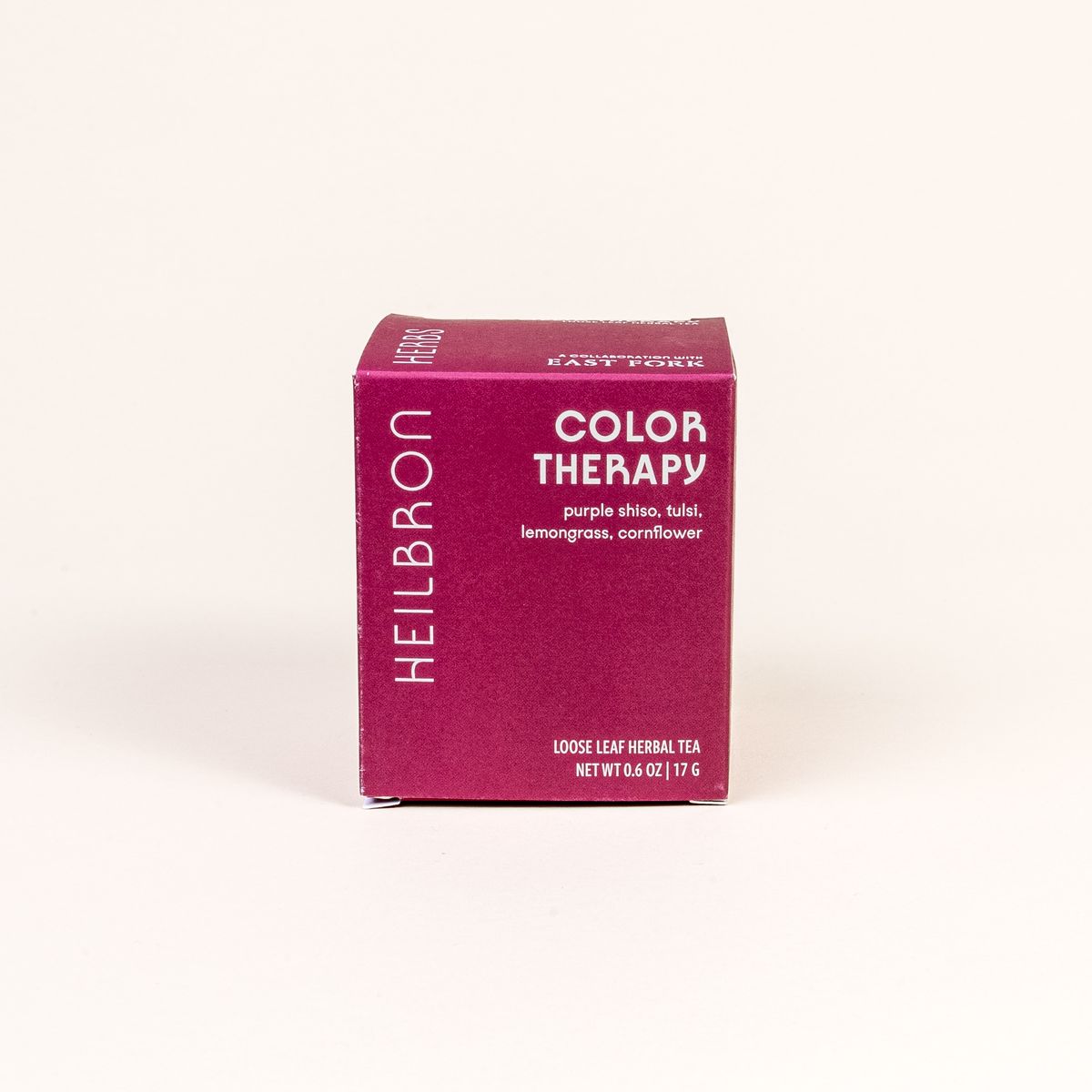 A red-purple box that reads 'Color Therapy' with loose leaf tea inside.