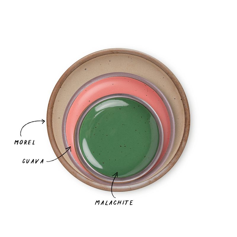 A stack of 3 plates in Dinner, Side, and Cake sizes in a pale warm brown, watermelon pink, and glossy emerald green colors.