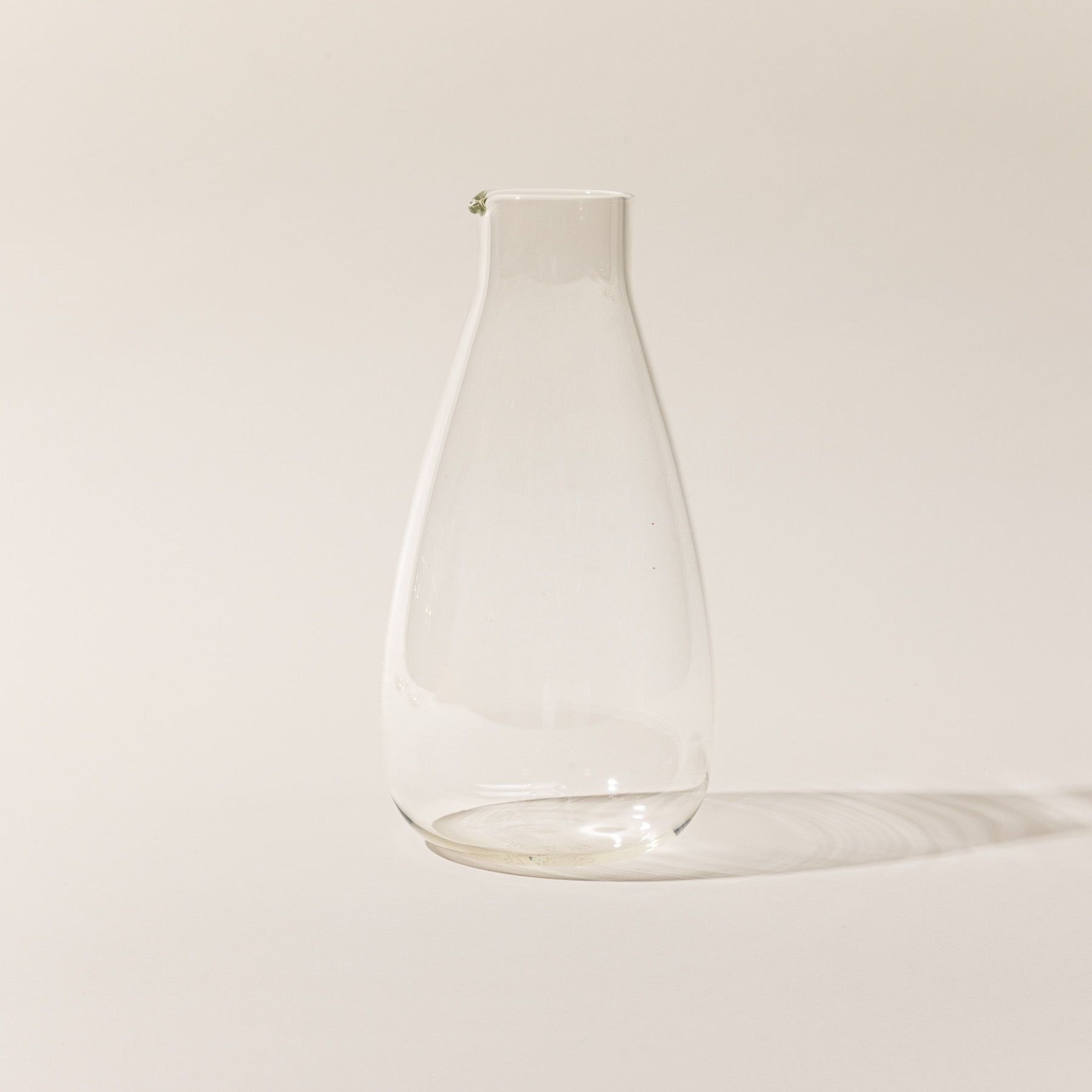 A simple elegant clear glass carafe