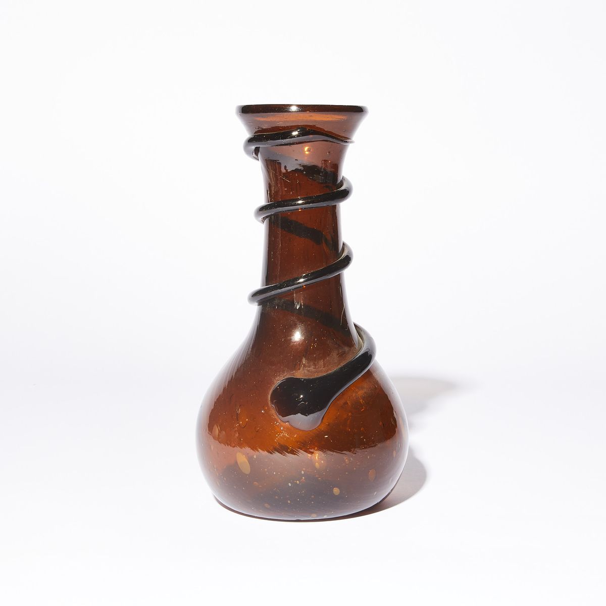 Translucent Brown glass vase with black swirl going up the neck