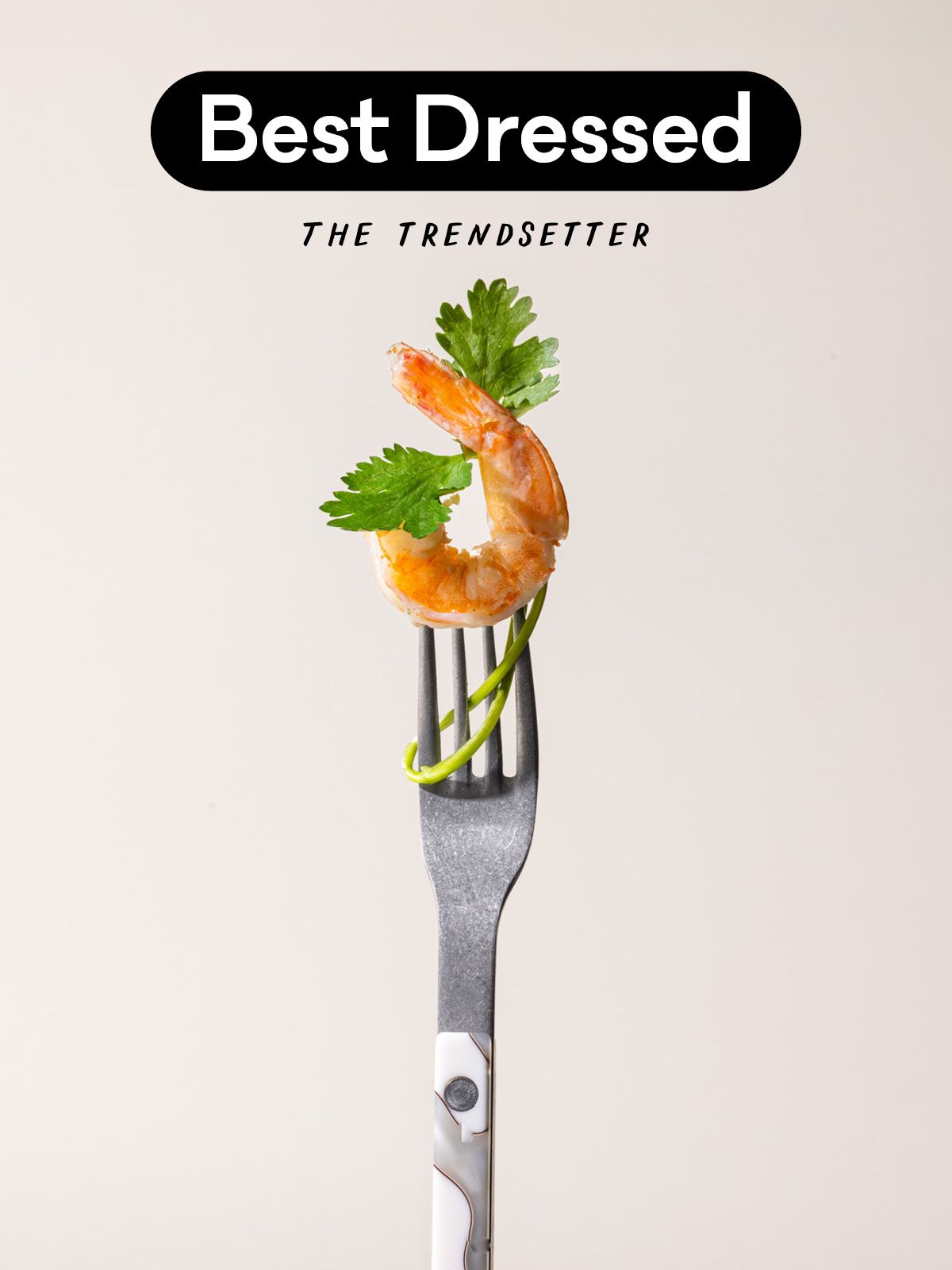 A white marble-handled fork with a shrimp on the prongs and text that reads "Best Dressed - The Trendsetter"