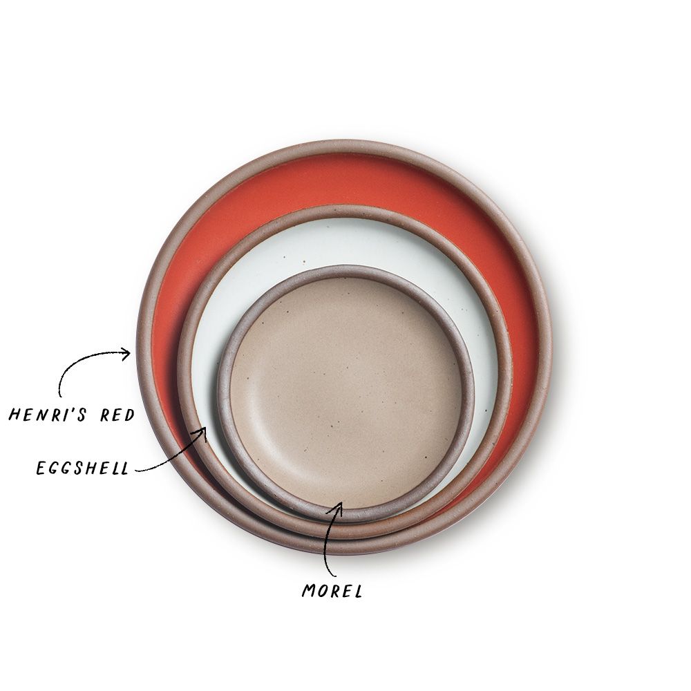 A stack of 3 plates in Dinner, Side, and Cake sizes in a bold red, white, and muted light brown colors.