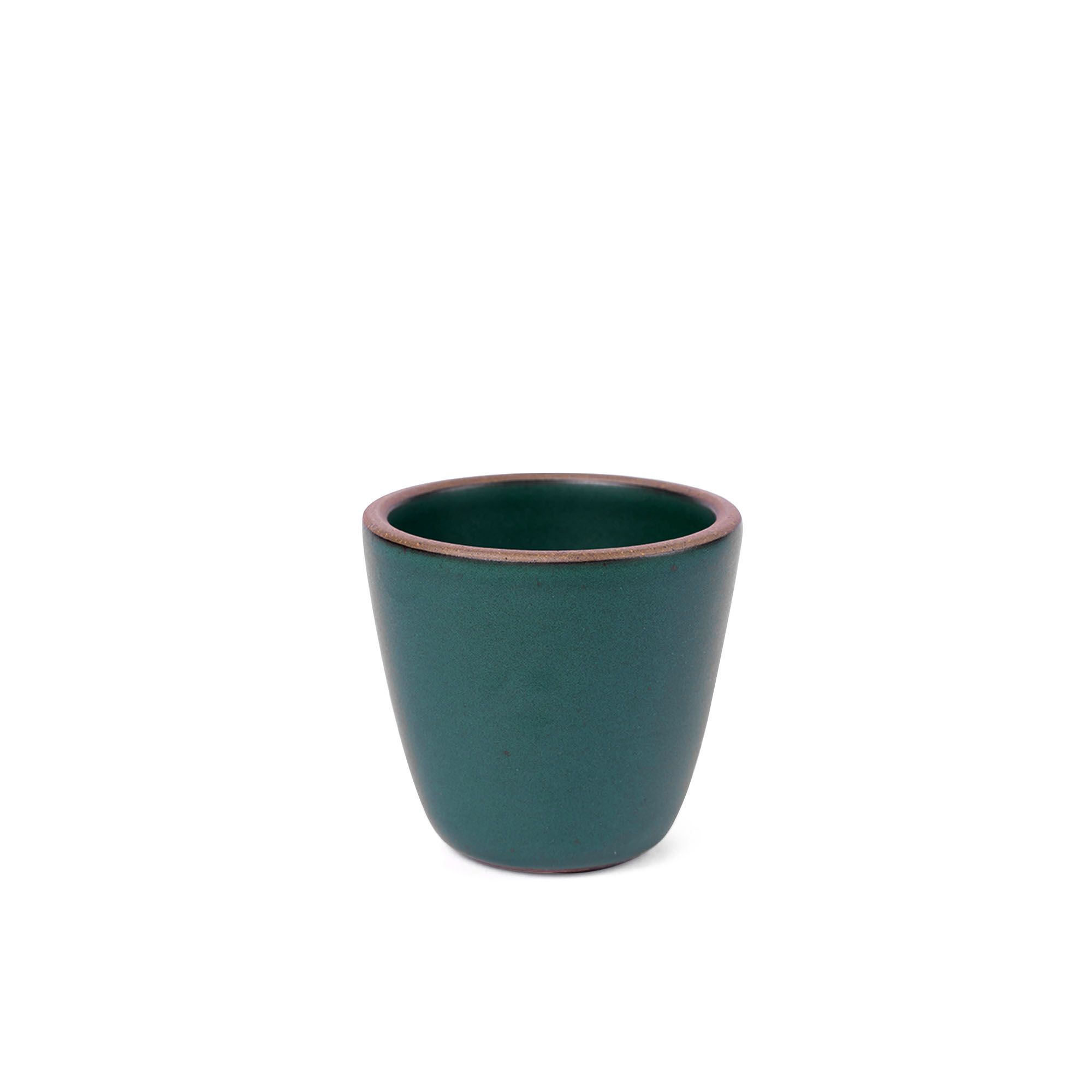 A short cup that tapers out to get wider at the top in a deep dark teal color featuring iron speckles