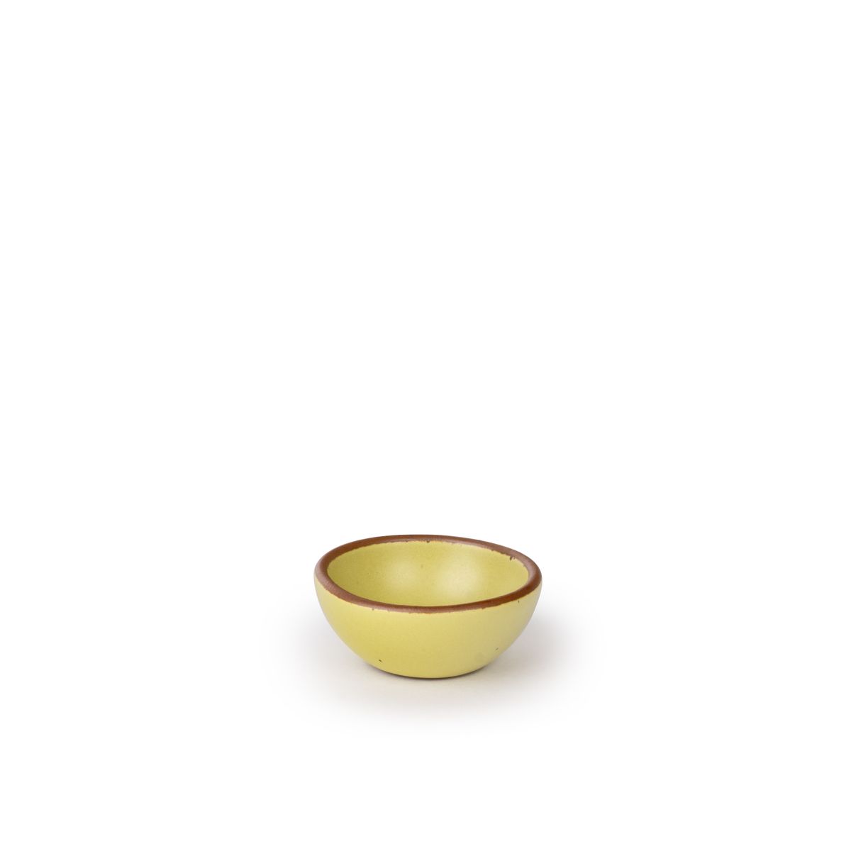 A tiny rounded ceramic bowl in a zesty yellow color featuring iron speckles and an unglazed rim