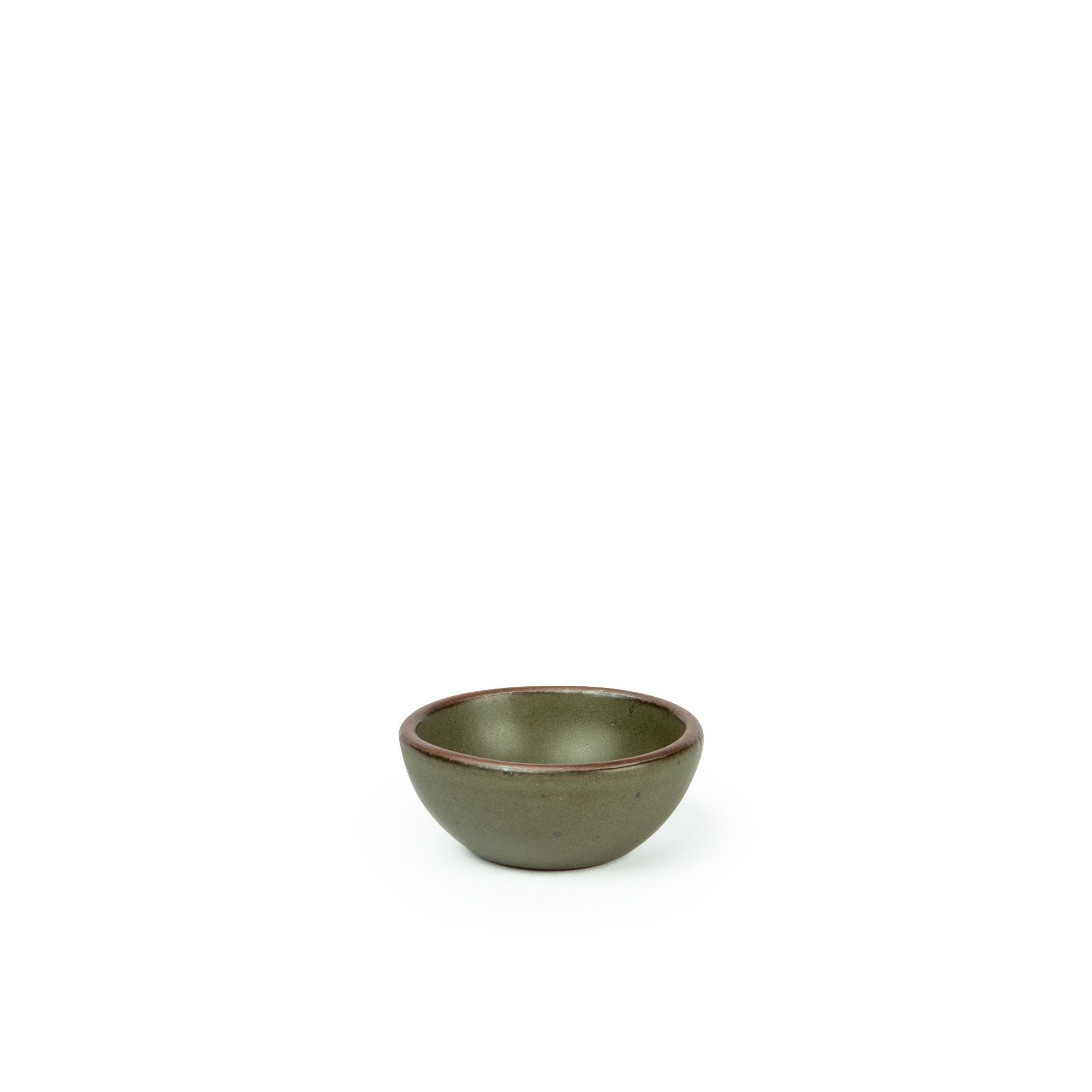 A tiny rounded ceramic bowl in an earthy green color featuring iron speckles and an unglazed rim