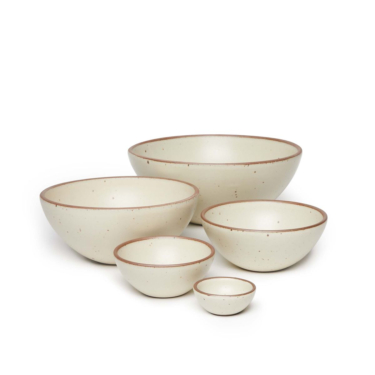 A bitty bowl, ice cream bowl, soup bowl, popcorn bowl, and mixing bowl paired together in a warm, tan-toned, off-white color featuring iron speckles