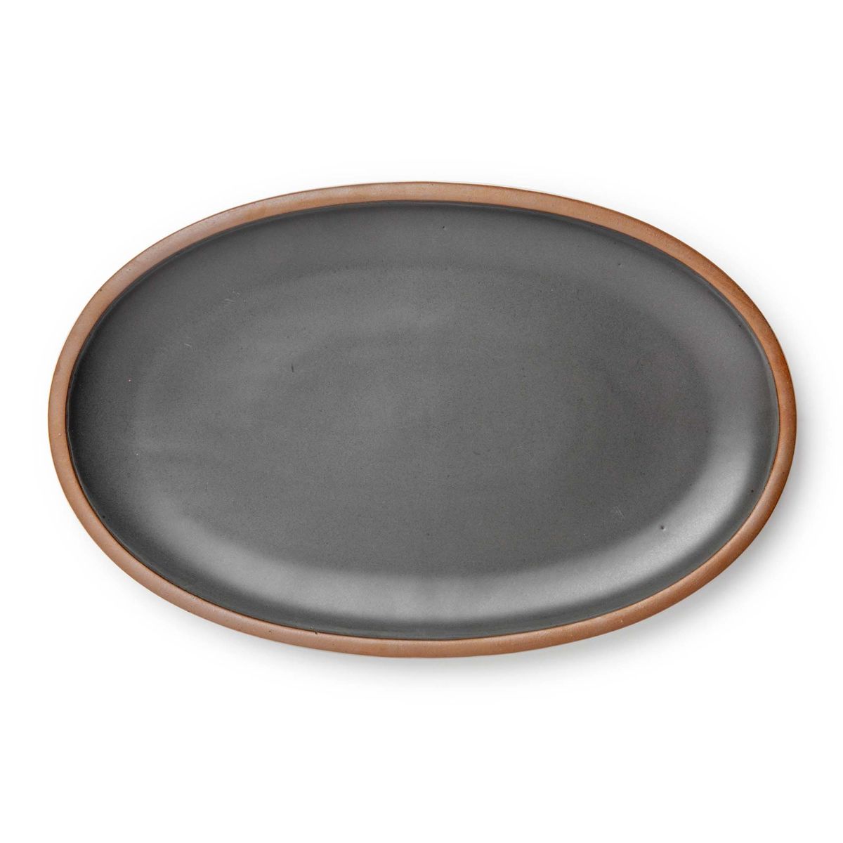 A large oval ceramic platter in a cool, medium grey color featuring iron speckles and an unglazed rim