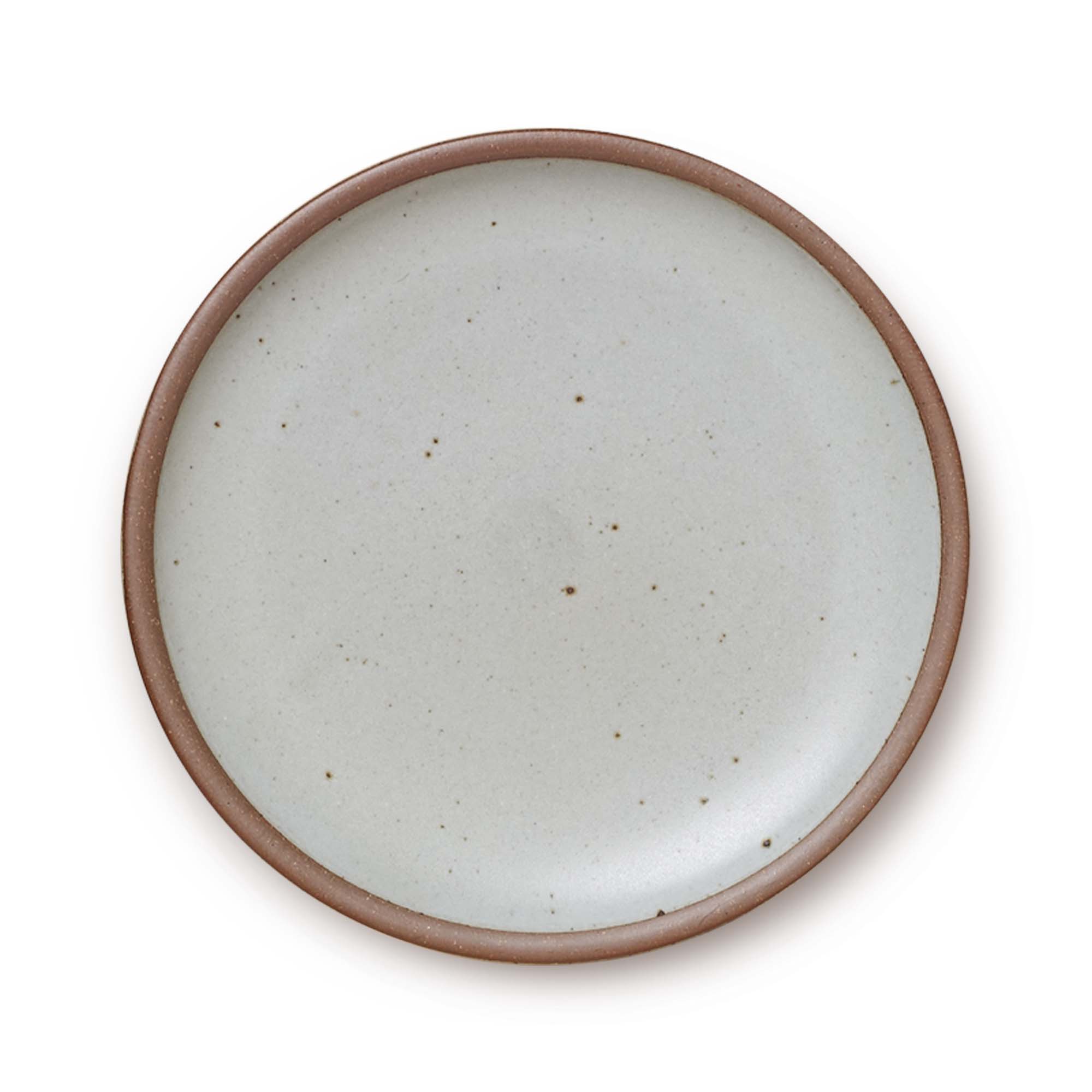 A large ceramic platter in a light gray color featuring iron speckles and an unglazed rim.