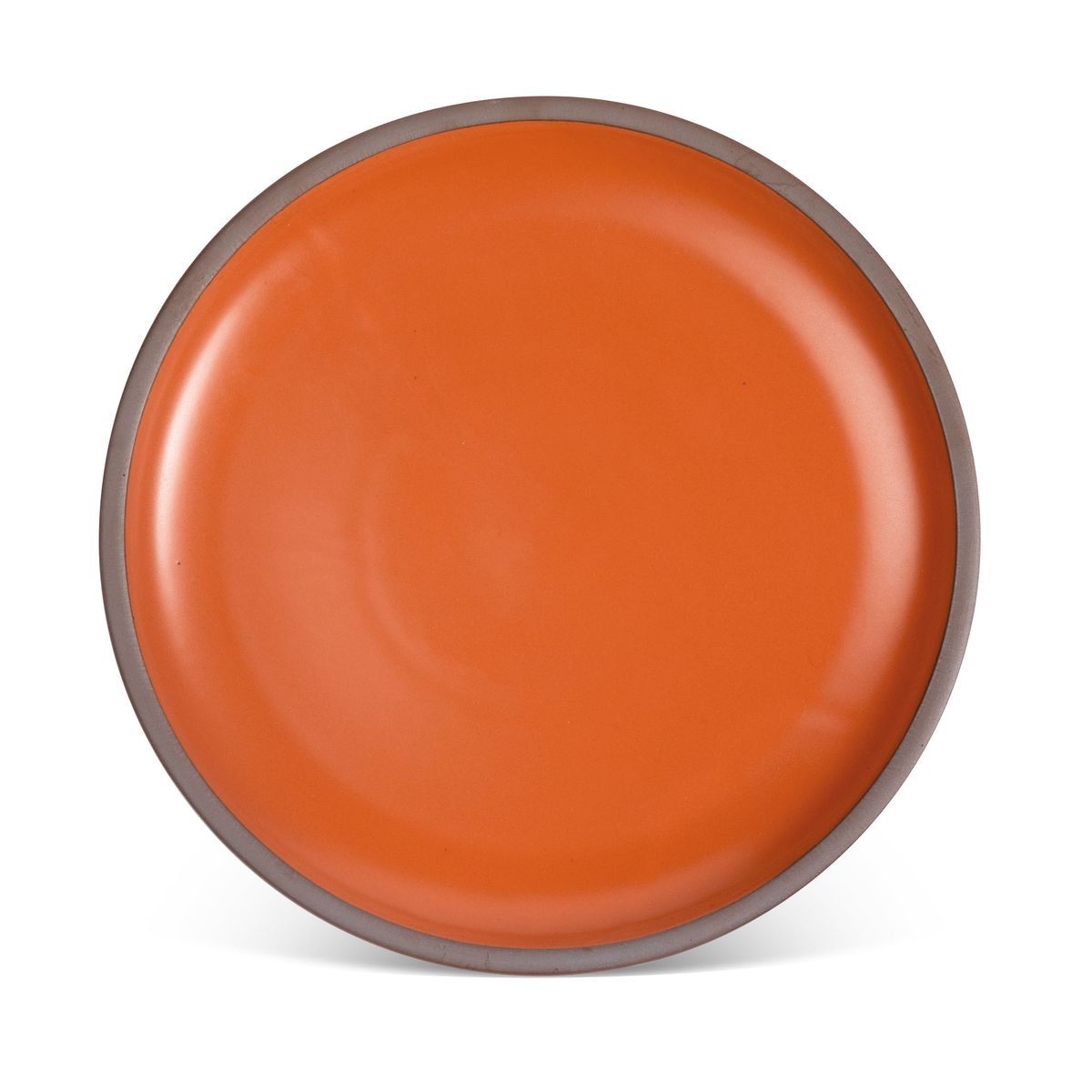 A large ceramic platter in a bold orange color featuring iron speckles and an unglazed rim