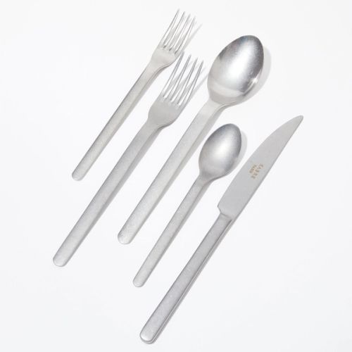 Two forks, two spoons, and a knife, all stainless steel