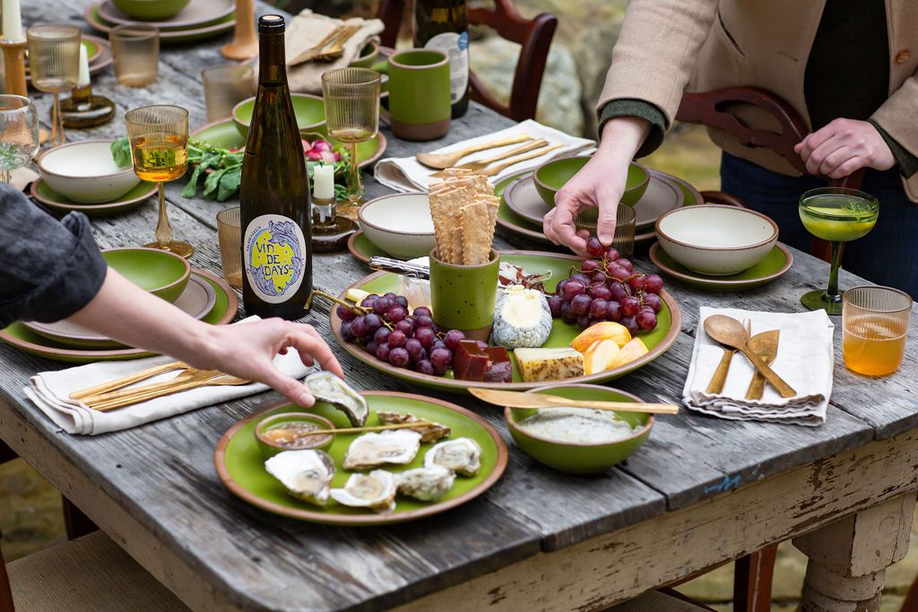 Various foods on East Fork plates in Fiddlehead green glaze