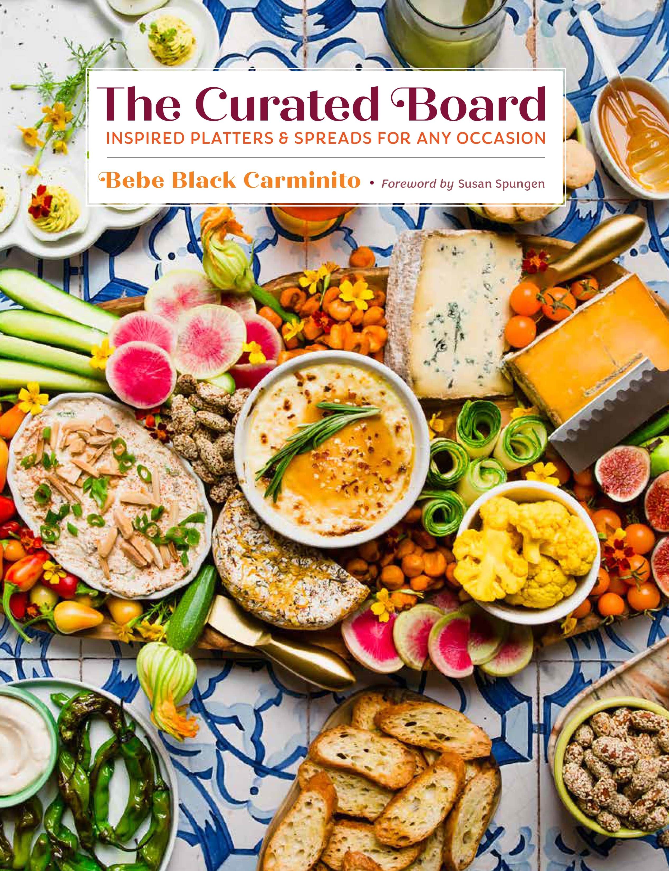 The cover of Bebe's book 'The Curated Board' with an artful board spread of colorful foods.