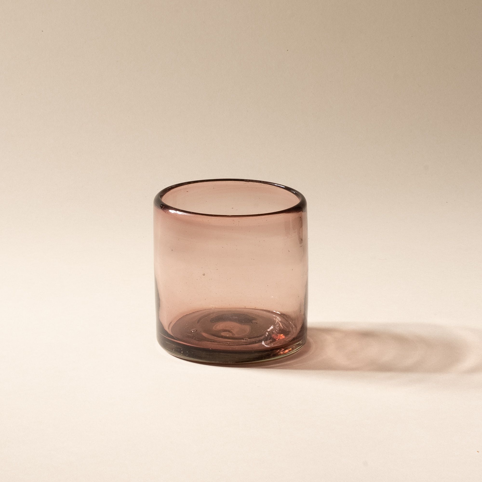 A light plum short transparent drinking glass