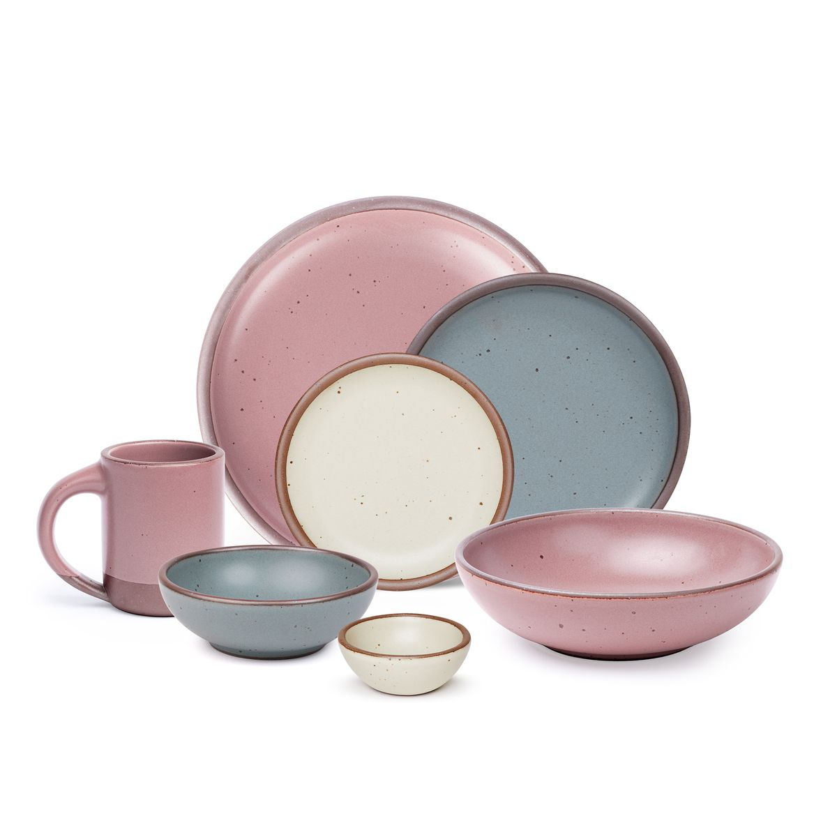 The side plate and breakfast bowl in blue-grey, the bitty bowl and cake plate in warm off-white, the mug, the everyday bowl and dinner plate in a dusty mauve pink color.