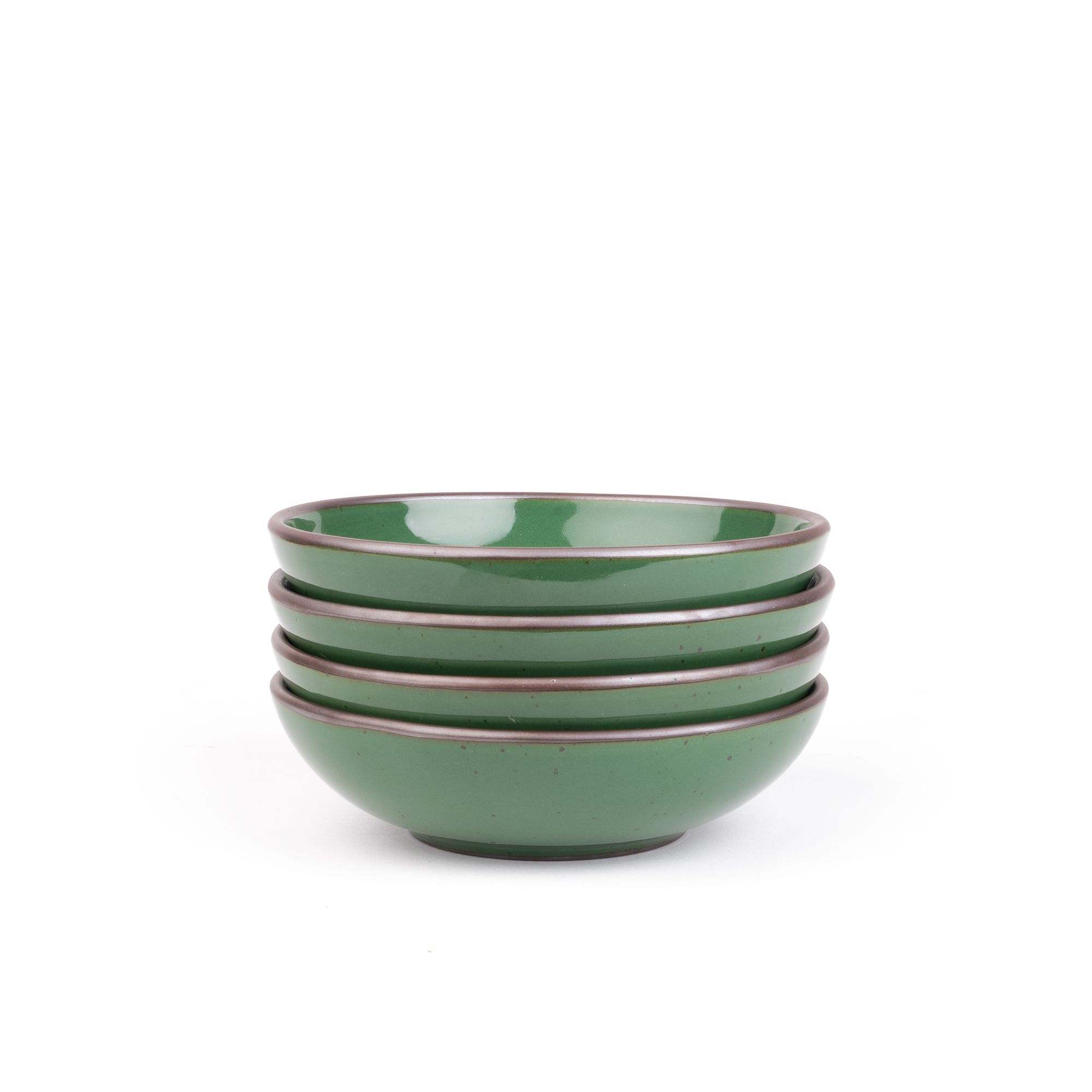 A stack of 4 dinner-sized shallow ceramic bowls in a glossy emerald green color featuring iron speckles and an unglazed rim