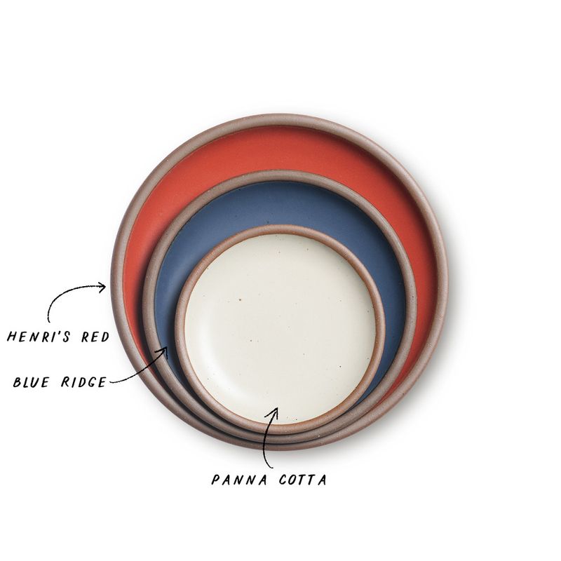 A stack of 3 plates in Dinner, Side, and Cake sizes in a bold red, navy, and warm off-white colors.