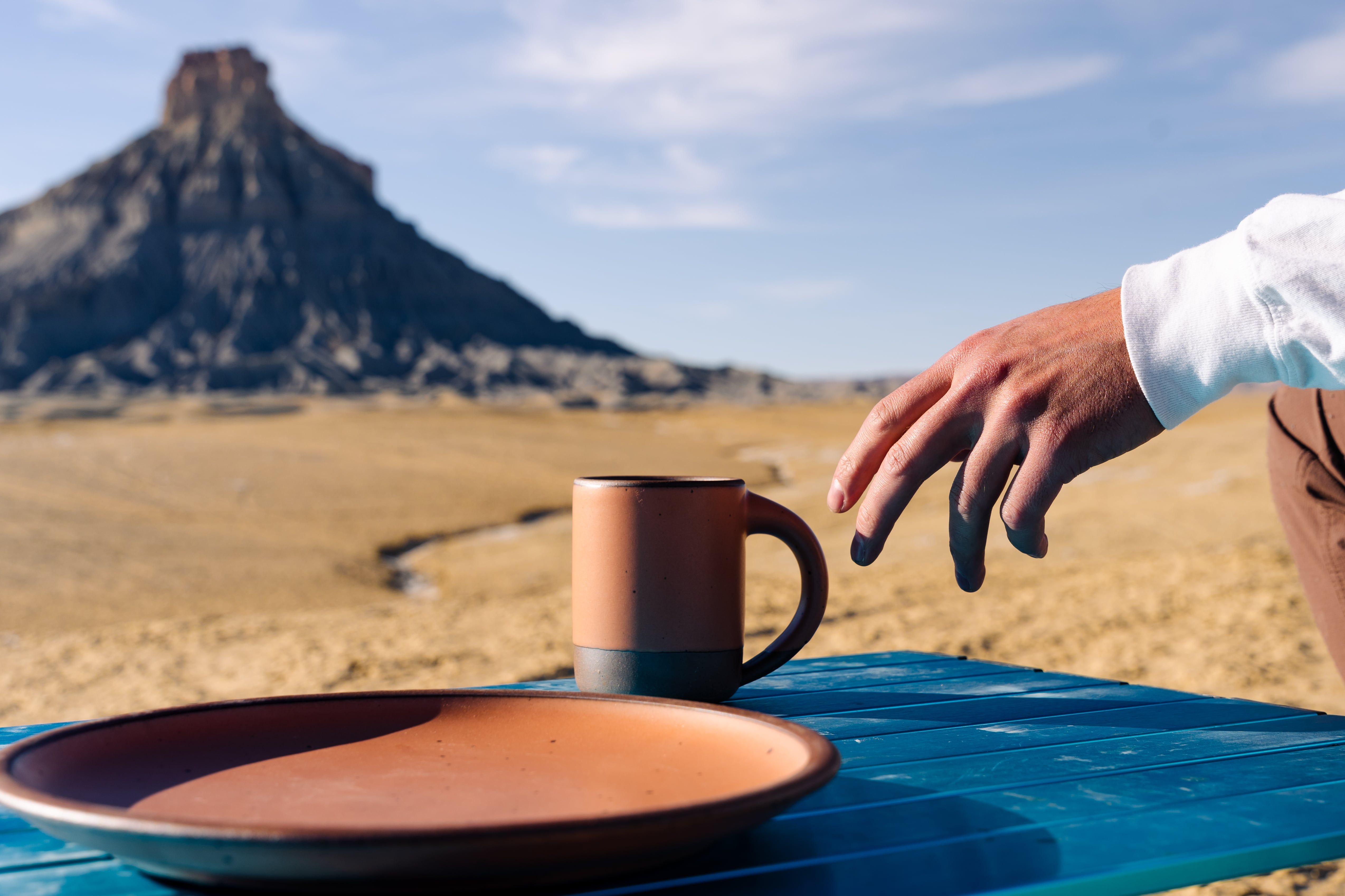 Marcus Catlett photo of hand reaching for Mug and Plate in Utah