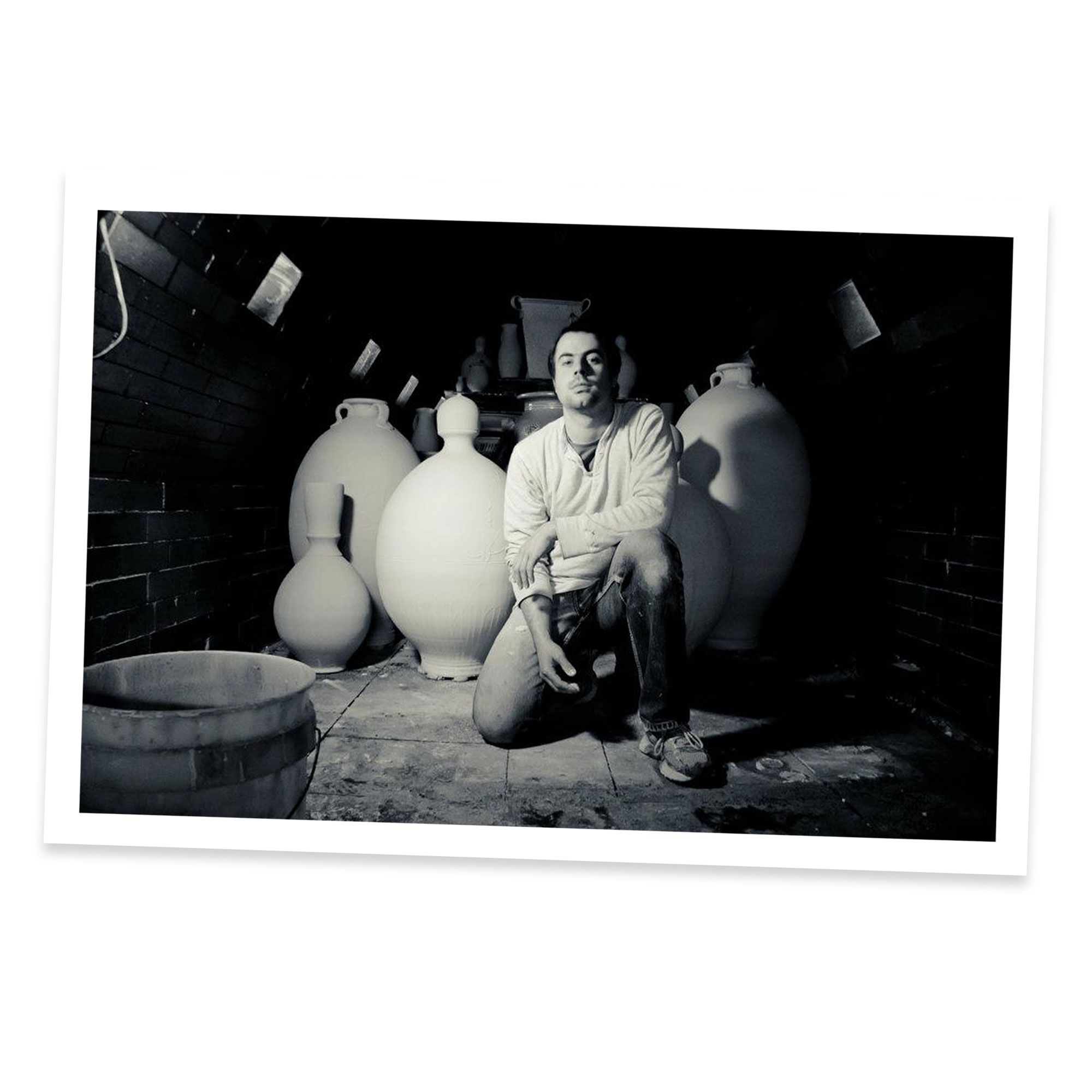 Founder Alex Matisse in the wood kiln with large pots