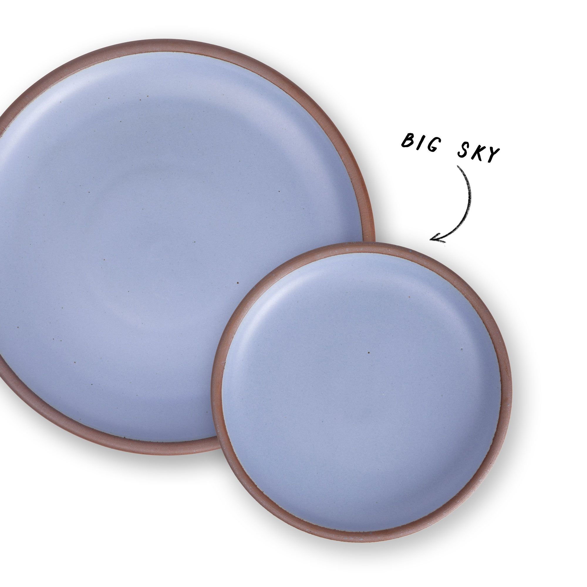 1 large and 1 small ceramic plate in a light periwinkle with an arrow pointing to both that reads 'Big Sky'