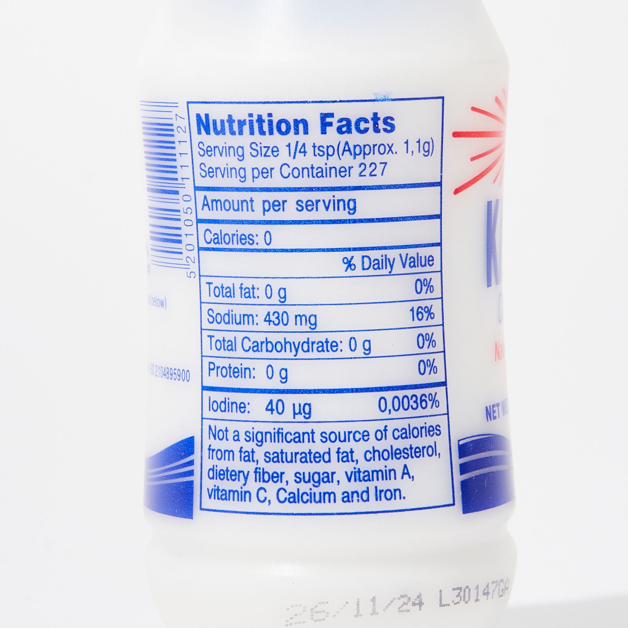 Close-up of a white translucent plastic bottle featuring nutritional facts in blue