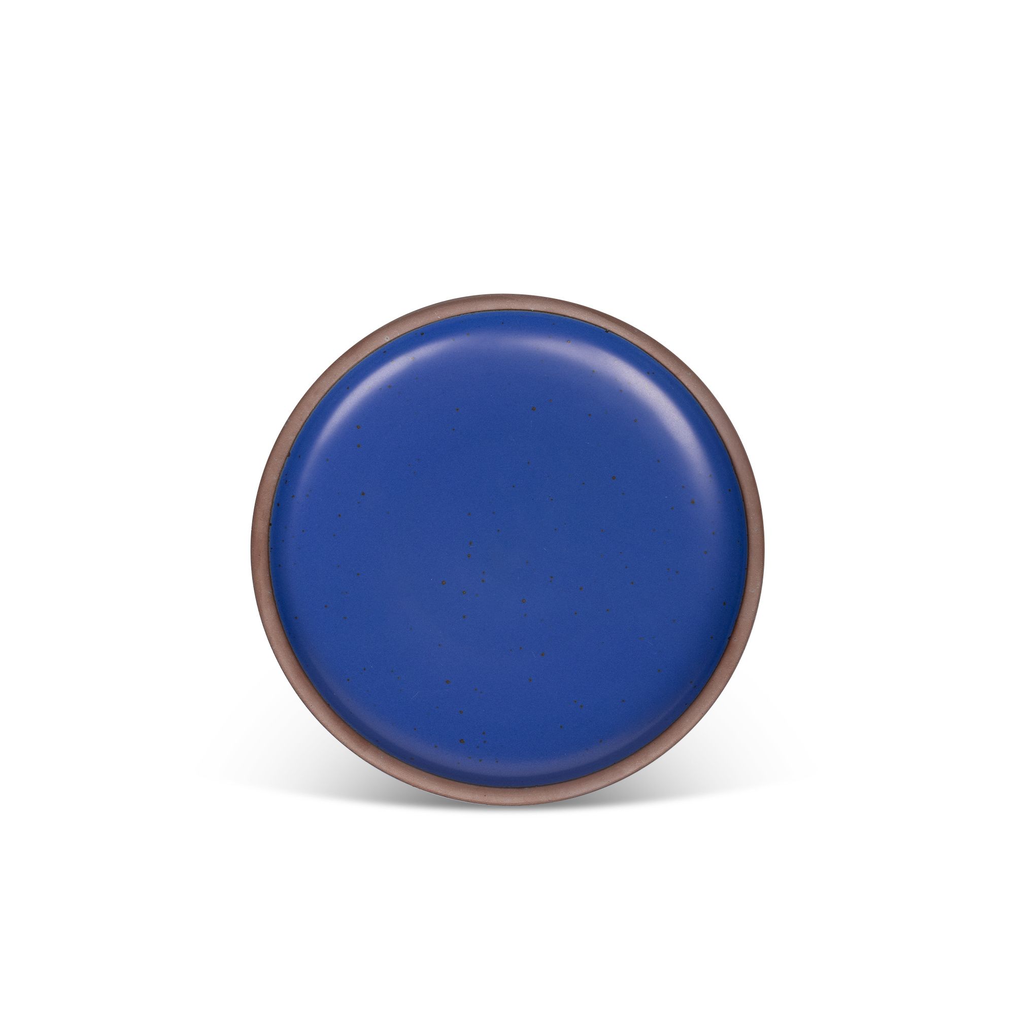 A medium sized ceramic plate in a cobalt blue color featuring iron speckles and an unglazed rim.