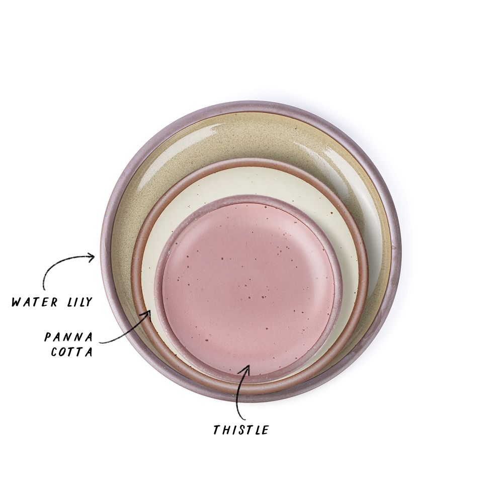 A stack of 3 plates in Dinner, Side, and Cake sizes in a reflective dappled grey-green, warm off-white, and dusty mauve pink.